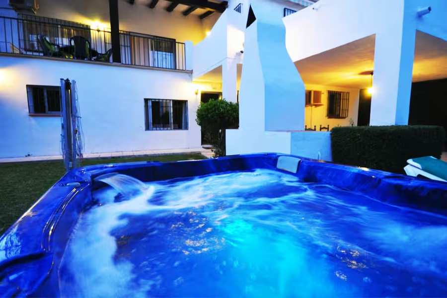 Jacuzzi at dusk in front of the house